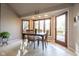 Cozy dining area with a view of the backyard and a patio entrance from the room at 4063 Millstream Rd, Greenwood, IN 46143