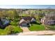Beautiful brick home featuring well-manicured lawn and mature trees, near a serene lake and golf course at 4063 Millstream Rd, Greenwood, IN 46143