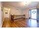 Foyer showcasing hardwood floors, a staircase, and view of the front door with sidelight windows at 4063 Millstream Rd, Greenwood, IN 46143