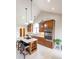 Bright kitchen with stainless steel appliances, granite countertops, island with seating and modern pendant lighting at 4063 Millstream Rd, Greenwood, IN 46143