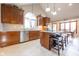 Modern kitchen featuring stainless steel appliances, custom cabinets, a granite countertop island and an open dining area at 4063 Millstream Rd, Greenwood, IN 46143