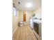 Laundry room with front load washer and dryer, folding shelf, and window at 4063 Millstream Rd, Greenwood, IN 46143