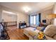 Comfortable living room with hardwood floors, window, and cozy seating area at 4063 Millstream Rd, Greenwood, IN 46143