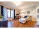 Comfortable and bright living room features hardwood floors, and a cozy armchair at 4063 Millstream Rd, Greenwood, IN 46143