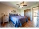 Main bedroom featuring a large window offering plenty of natural light and dark-stained hardwood floors at 4063 Millstream Rd, Greenwood, IN 46143