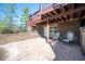 Brick patio is shaded by upper deck offering a peaceful outdoor space at 4063 Millstream Rd, Greenwood, IN 46143