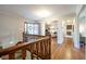 View from the top of the stairs shows access to living room, entryway, and kitchen at 4063 Millstream Rd, Greenwood, IN 46143