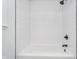 Clean bathroom featuring a white bathtub, white subway tiles, and modern fixtures at 4106 Armon Ct, Carmel, IN 46033