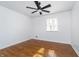 Cozy bedroom with hardwood floors, a ceiling fan, and a bright window with natural light at 4106 Armon Ct, Carmel, IN 46033