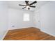 Bright bedroom with ceiling fan, hardwood floors, and a window providing natural light at 4106 Armon Ct, Carmel, IN 46033