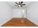 Spacious bedroom showcasing hardwood floors and an attached bathroom at 4106 Armon Ct, Carmel, IN 46033