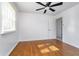 Bedroom features hardwood floors, a ceiling fan, and a bright window with natural light at 4106 Armon Ct, Carmel, IN 46033