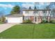 Charming two-story home with a well-manicured lawn and attached two car garage at 4106 Armon Ct, Carmel, IN 46033