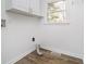Efficient laundry room with overhead cabinets and a bright window at 4106 Armon Ct, Carmel, IN 46033