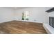 Spacious living room with hardwood floors, fireplace, and walkout french doors at 4106 Armon Ct, Carmel, IN 46033