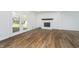 Spacious living room with hardwood floors, fireplace, and walkout french doors at 4106 Armon Ct, Carmel, IN 46033