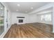 Spacious living room with hardwood floors, fireplace, and natural lighting at 4106 Armon Ct, Carmel, IN 46033