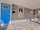 The home's front porch with blue door at 430 and boarded up window at 432 N Hamilton Ave, Indianapolis, IN 46201