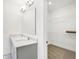 Bathroom showcasing double sinks, modern vanity lights, and a walk-in closet at 4327 Persian St, Greenwood, IN 46143