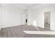 Bright bedroom featuring neutral carpet and an open doorway to an adjoining room at 4327 Persian St, Greenwood, IN 46143