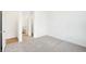 Spacious bedroom with light carpet and an adjoining bathroom at 4327 Persian St, Greenwood, IN 46143