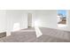Sunlit bedroom featuring neutral carpet, white walls and a large window overlooking the outside at 4327 Persian St, Greenwood, IN 46143