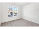 Bright room with large window, gray carpet, and natural light at 4327 Persian St, Greenwood, IN 46143