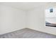 Bright room with gray carpet, white walls, and natural light at 4327 Persian St, Greenwood, IN 46143
