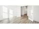 Bright flex room with wood flooring and natural light pouring in through the glass french doors at 4327 Persian St, Greenwood, IN 46143