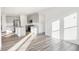 Open kitchen with stainless steel appliances, granite island, and hardwood floors at 4327 Persian St, Greenwood, IN 46143