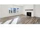 Bright living room featuring a fireplace and large windows at 4327 Persian St, Greenwood, IN 46143