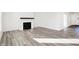 Open-concept living room featuring a fireplace and bright light at 4327 Persian St, Greenwood, IN 46143