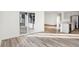 Open floor plan shows living room with sliding glass doors leading to a kitchen with island at 4327 Persian St, Greenwood, IN 46143