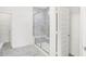 Modern shower featuring marble tiling, glass doors, and a built-in bench at 4327 Persian St, Greenwood, IN 46143