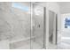 Shower featuring stylish tile, a frameless glass door, and natural light at 4327 Persian St, Greenwood, IN 46143