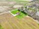 Scenic aerial view of a home on a lush lot surrounded by expansive farmland at 4339 W Briarwood Rd, Monrovia, IN 46157