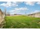 Expansive grassy backyard bordered by a chain-link fence, perfect for outdoor activities and privacy at 4339 W Briarwood Rd, Monrovia, IN 46157