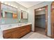 Spacious bathroom with double vanity, mirrors, and a walk-in closet for storage at 4339 W Briarwood Rd, Monrovia, IN 46157