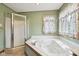 Bathroom features a soaking tub, shower stall, and a window for natural light at 4339 W Briarwood Rd, Monrovia, IN 46157