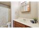 This bathroom features a single sink, a vanity with storage, a shower and bathtub combination, and neutral decor at 4339 W Briarwood Rd, Monrovia, IN 46157