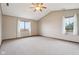 Bright and airy bedroom with plush carpeting, large windows, and ceiling fan for added comfort at 4339 W Briarwood Rd, Monrovia, IN 46157