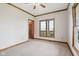 Carpeted bedroom featuring a ceiling fan, natural lighting, and wood accents at 4339 W Briarwood Rd, Monrovia, IN 46157