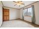 This bedroom features carpeted floors, crown molding, a ceiling fan, and a window with curtains at 4339 W Briarwood Rd, Monrovia, IN 46157