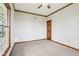 Carpeted bedroom with light walls, wood trim, and natural light from the window at 4339 W Briarwood Rd, Monrovia, IN 46157