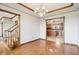 Dining room with staircase and view of the kitchen at 4339 W Briarwood Rd, Monrovia, IN 46157
