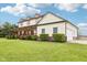 A spacious home with an attached garage and expansive front yard, featuring a charming covered porch at 4339 W Briarwood Rd, Monrovia, IN 46157