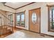 Welcoming foyer with a staircase, decorative molding, and a stylish front door, radiating classic charm at 4339 W Briarwood Rd, Monrovia, IN 46157