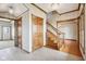 Bright and spacious foyer features tile flooring, staircase, and multiple doorways, offering a grand entrance at 4339 W Briarwood Rd, Monrovia, IN 46157