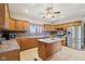 Charming kitchen with stainless steel appliances, center island, and stone backsplash at 4339 W Briarwood Rd, Monrovia, IN 46157