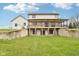 Expansive two-story home with large deck and exterior access to lower level overlooking a sprawling yard at 4339 W Briarwood Rd, Monrovia, IN 46157